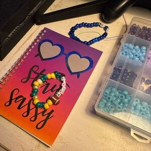 Green Bay packers football bracelet with a football , green and yellow beads .